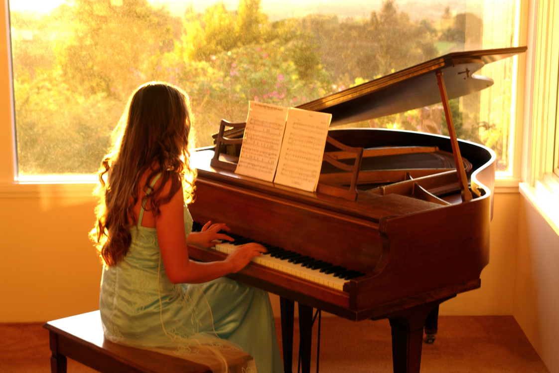Teenage girl playing piano